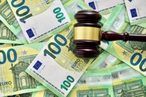 udge or auctioneer gavel on a euro money background
